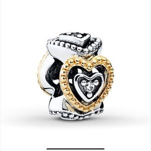 A pair of Pandora two tone charms